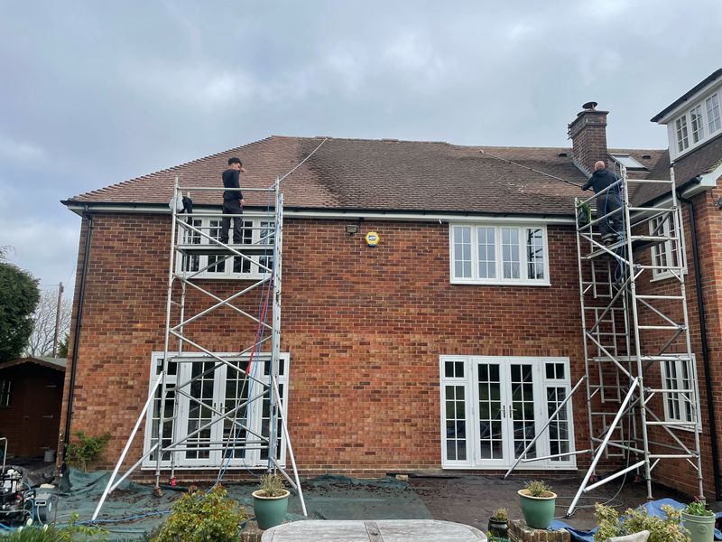 Roof cleaning carried out safely from scaffold towers by The Roof Moss Cleaners in Nuneaton